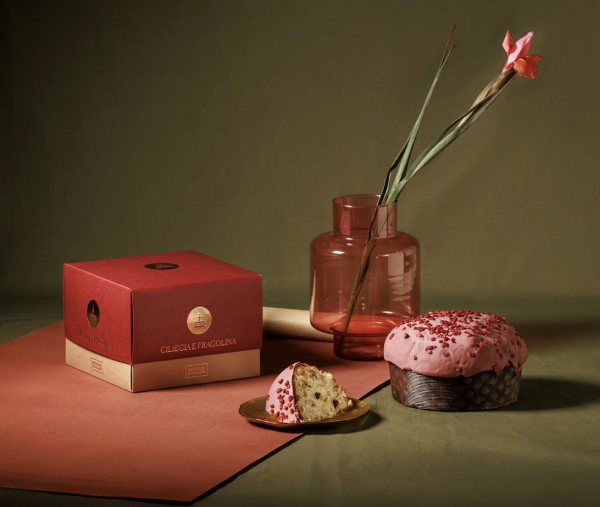 Panettone with mint essence and semi candied strawberries, topped with Sicilian cherries jam and chocolate box