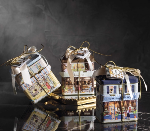 Assorted biscuits in decorative Cosy House metal vintage tin